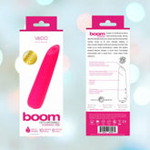 The image illustrates the front and back packaging of a product called "VeDO Boom Rechargeable Warming Bullet Vibrator" in pink. The front showcases the product along with its exciting vibrations, while the back features detailed information, instructions, and specifications.